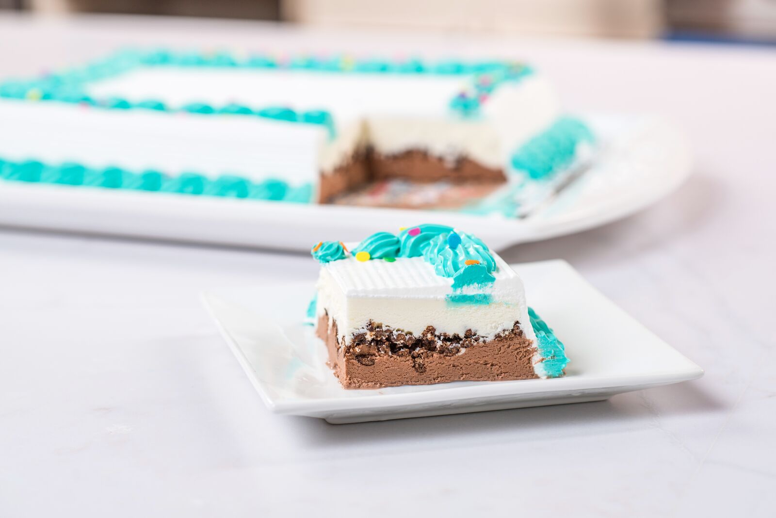 cut ice cream cake on plate